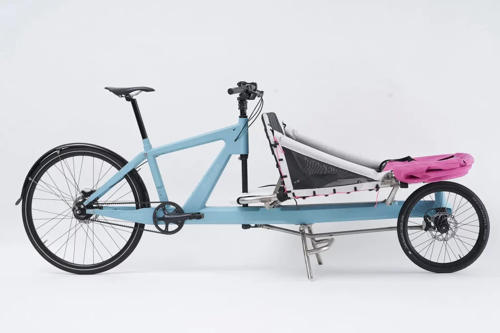Side view of Sky Blue VeloSled Anna parked in studio