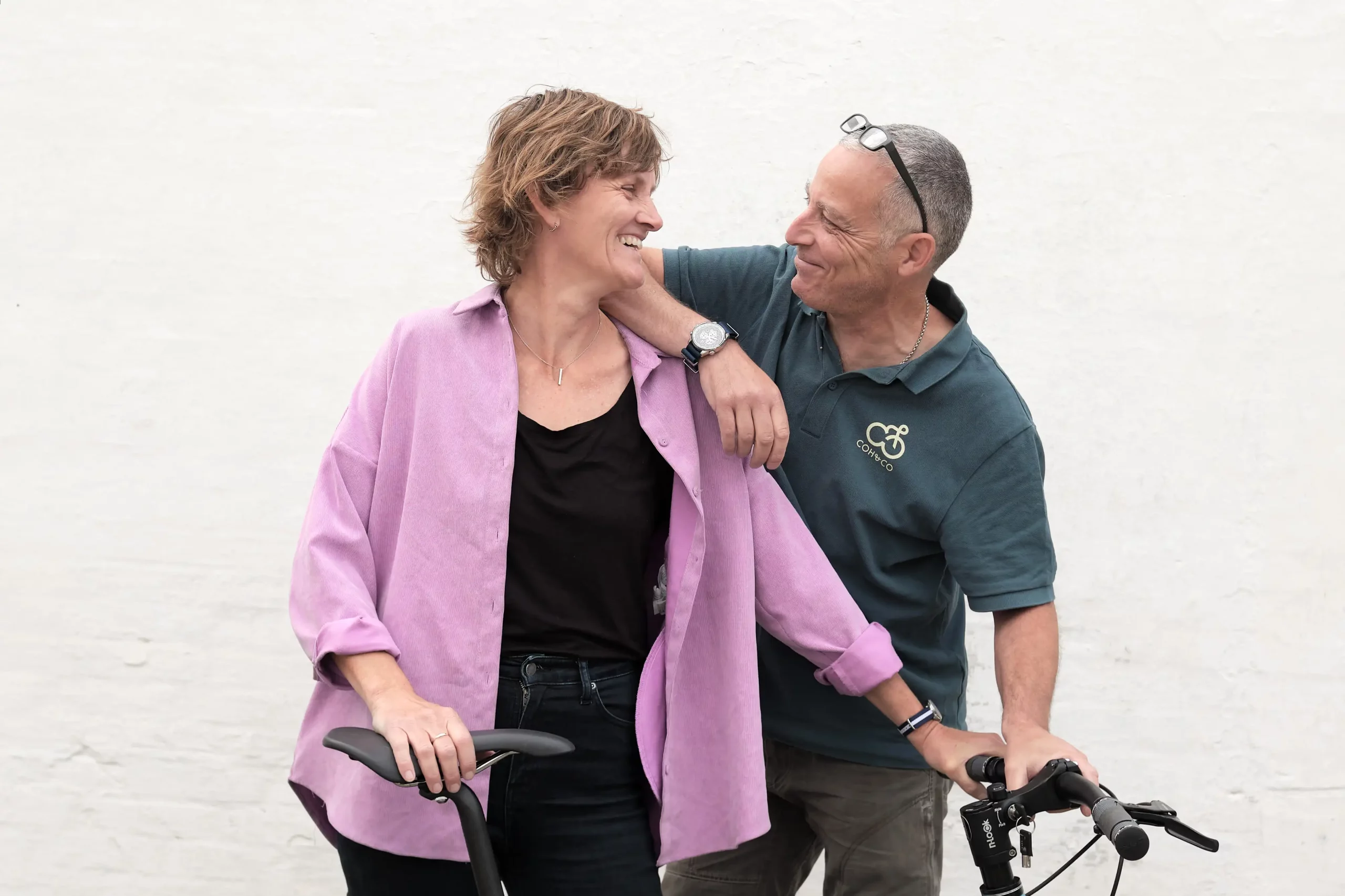 Coh&Co founders, Mette and Paul, laugh while looking at each other at the bikefarm in Kelstrup, Slagelse