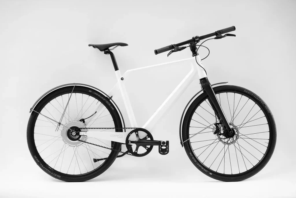 Sideview of folded white Erik Urban SlimBike in studio