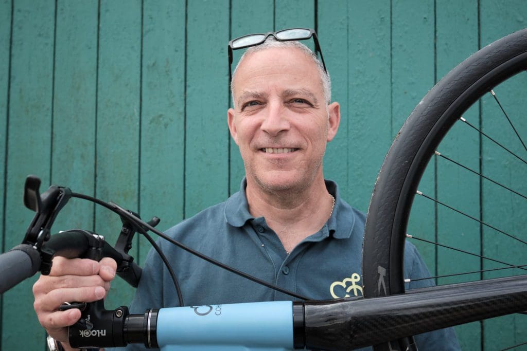 Coh&Co founder Paul Harder Cohen holding a bike at the Danish bicycle company Coh&Co's bikefarm in Kelstrup, Slagelse